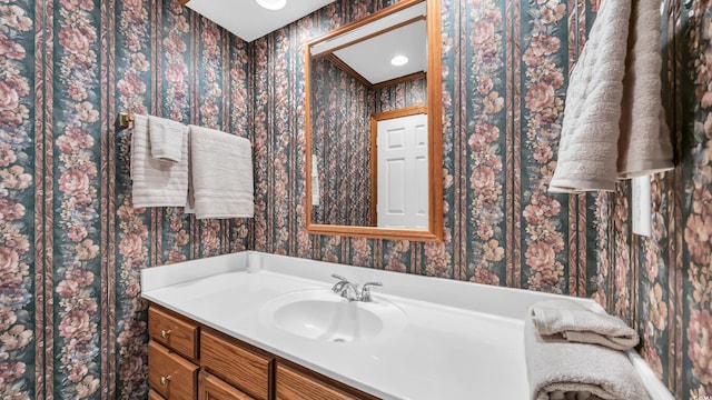 412 Carolina Dr, Loris, SC 29569 - bathroom with wallpapered walls and vanity
