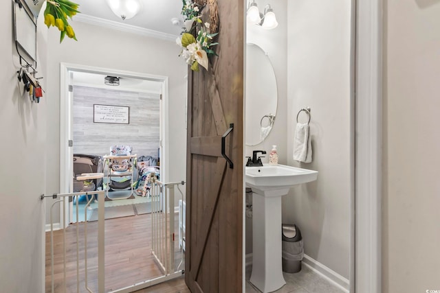 4927 Sandlewood Dr, Myrtle Beach, SC 29579 - bathroom with ornamental molding, baseboards, and a sink