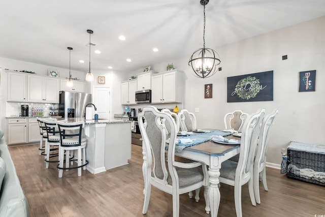 4927 Sandlewood Dr, Myrtle Beach, SC 29579 - dining room featuring a chandelier, light wood-style flooring, and recessed lighting