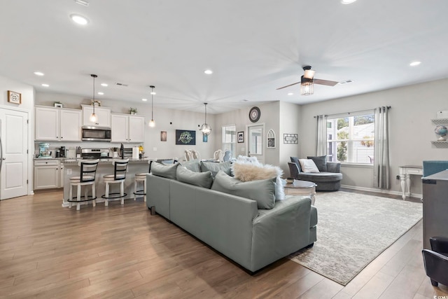 4927 Sandlewood Dr, Myrtle Beach, SC 29579 - living room with recessed lighting, light wood-style floors, and ceiling fan