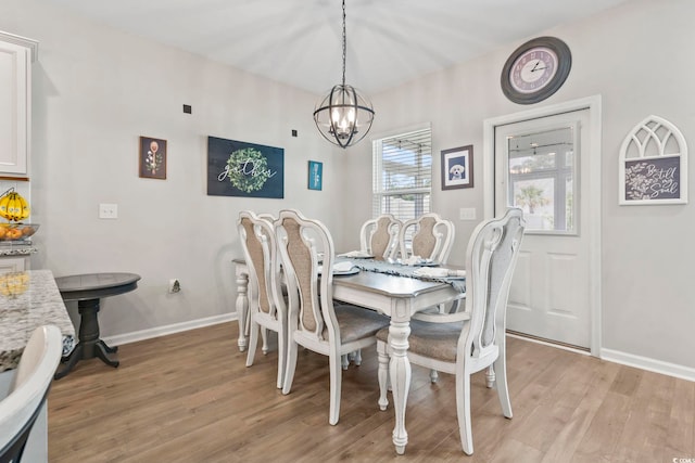 4927 Sandlewood Dr, Myrtle Beach, SC 29579 - dining room featuring a chandelier, light wood-type flooring, and baseboards