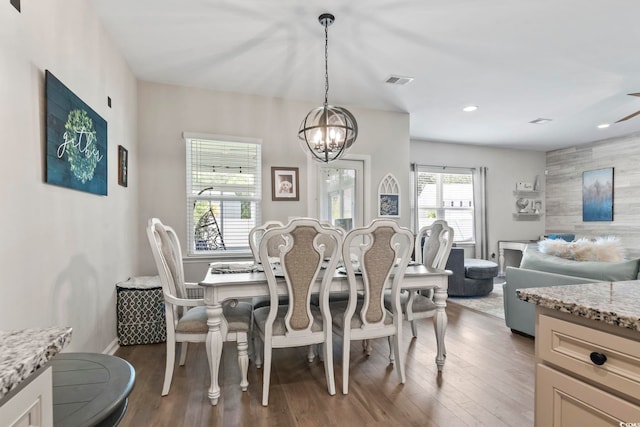 4927 Sandlewood Dr, Myrtle Beach, SC 29579 - dining room with a chandelier, wood finished floors, and recessed lighting