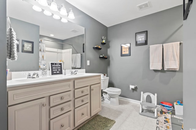 4927 Sandlewood Dr, Myrtle Beach, SC 29579 - bathroom featuring double vanity, toilet, curtained shower, tile patterned floors, and baseboards