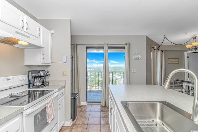 5905 S Kings Hwy Unit 1816Rt, Myrtle Beach, SC 29575 - kitchen featuring electric stove, a sink, under cabinet range hood, and white cabinets