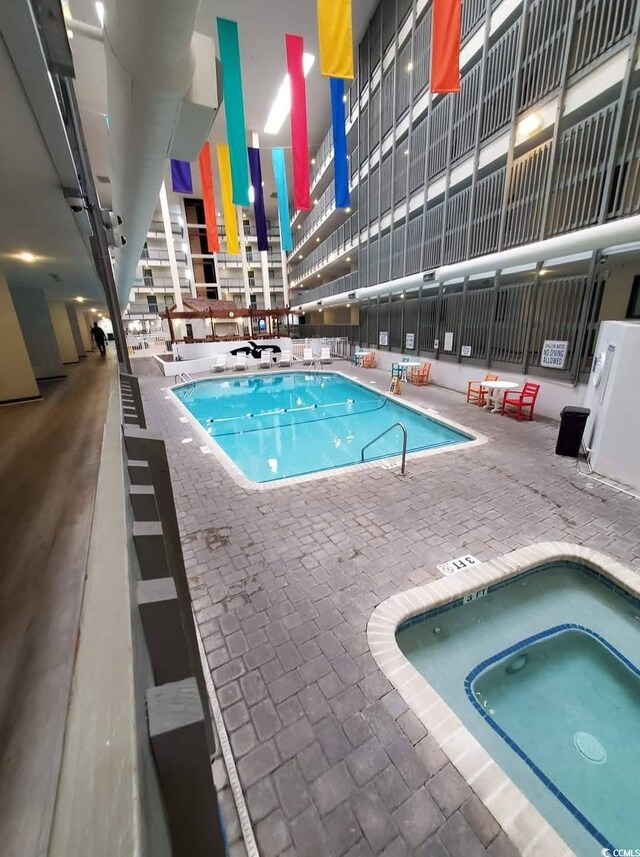 5905 S Kings Hwy Unit 1816Rt, Myrtle Beach, SC 29575 - indoor pool featuring a hot tub and a patio
