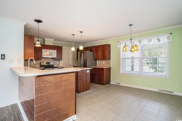 1001 Greencrest Ct, Conway, SC 29526 - kitchen with appliances with stainless steel finishes, tasteful backsplash, light countertops, and crown molding