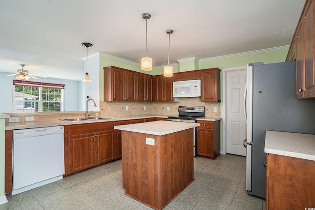 1001 Greencrest Ct, Conway, SC 29526 - kitchen featuring stainless steel appliances, a sink, backsplash, light countertops, and a center island