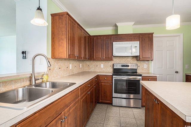 1001 Greencrest Ct, Conway, SC 29526 - kitchen with white microwave, stainless steel range with electric stovetop, a sink, crown molding, and backsplash