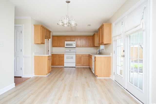 112 Molinia Dr, Murrells Inlet, SC 29576 - kitchen with white appliances, a chandelier, a sink, and light wood finished floors