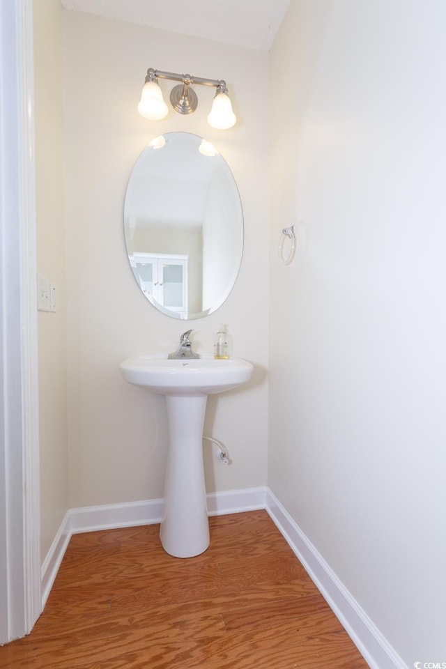 112 Molinia Dr, Murrells Inlet, SC 29576 - bathroom featuring baseboards and wood finished floors