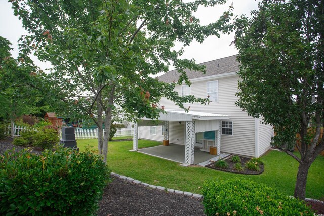 112 Molinia Dr, Murrells Inlet, SC 29576 - rear view of property with a patio and roof with shingles