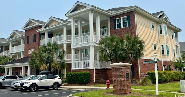 1029 Ray Costin Way Unit 909, Murrells Inlet, SC 29576 - view of building exterior with uncovered parking