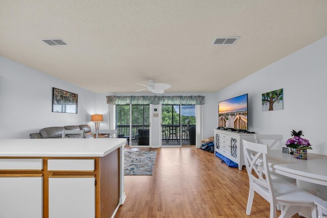 923 Fairwood Lakes Ln Unit 923G, Myrtle Beach, SC 29588 - living room featuring a ceiling fan, a textured ceiling, and light wood-style flooring