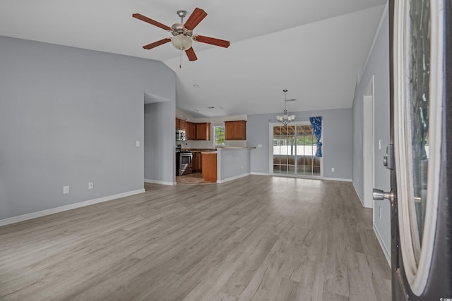 1220 Dunraven Ct, Conway, SC 29527 - unfurnished living room with lofted ceiling, a chandelier, ceiling fan, light wood-style floors, and baseboards
