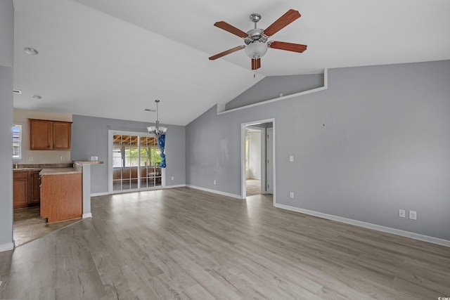 1220 Dunraven Ct, Conway, SC 29527 - unfurnished living room with a chandelier, ceiling fan, baseboards, and vaulted ceiling