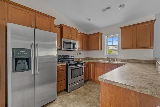 1220 Dunraven Ct, Conway, SC 29527 - kitchen with stainless steel appliances, a sink, brown cabinets, lofted ceiling, and recessed lighting