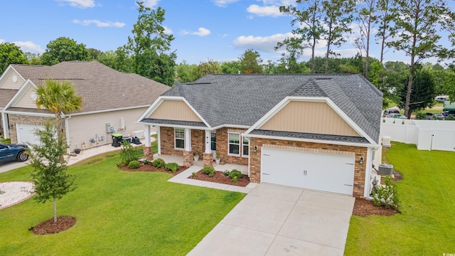 131 Crabapple Dr, Longs, SC 29568 - craftsman inspired home featuring concrete driveway, a garage, roof with shingles, cooling unit, and stone siding
