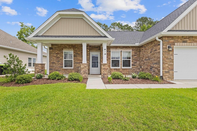 131 Crabapple Dr, Longs, SC 29568 - craftsman house featuring board and batten siding, a front yard, stone siding, and a shingled roof