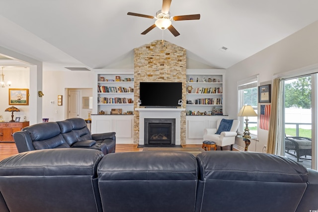 131 Crabapple Dr, Longs, SC 29568 - living room featuring wood finished floors, ceiling fan, vaulted ceiling, and built in features