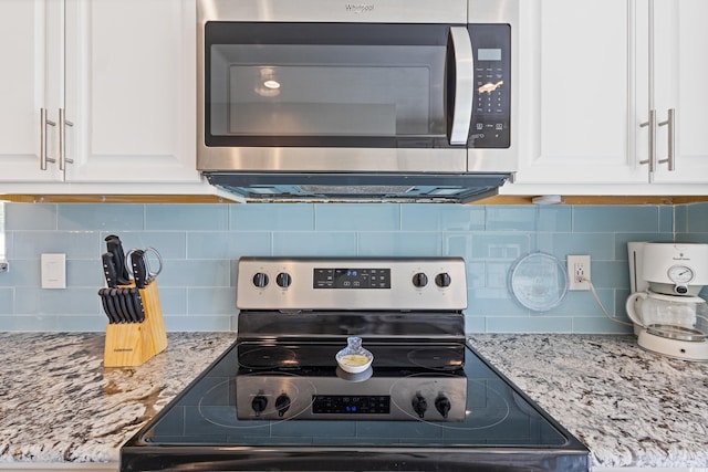 131 Crabapple Dr, Longs, SC 29568 - kitchen view of appliances with stainless steel finishes, white cabinetry, and decorative backsplash