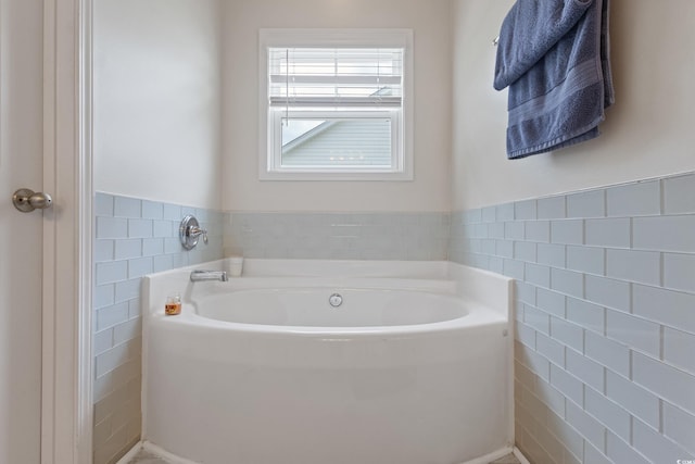 131 Crabapple Dr, Longs, SC 29568 - bathroom with tile walls, a garden tub, and a wainscoted wall