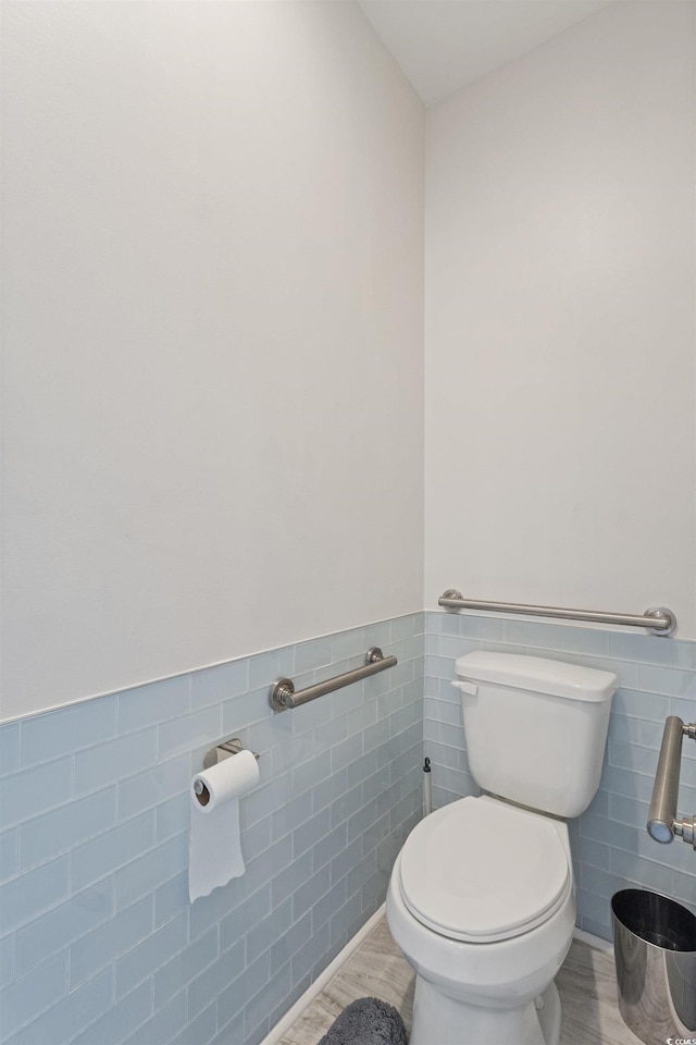 131 Crabapple Dr, Longs, SC 29568 - bathroom with tile walls, toilet, wainscoting, and wood finished floors