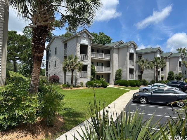 398 Blue Stem Dr Unit 59E, Pawleys Island, SC 29585 - view of property with uncovered parking