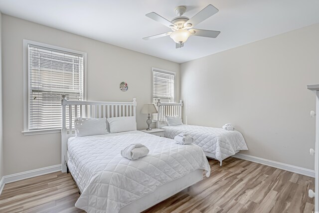 1613 Havens Dr, North Myrtle Beach, SC 29582 - bedroom featuring baseboards, wood finished floors, and ceiling fan
