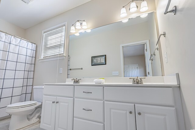 1613 Havens Dr, North Myrtle Beach, SC 29582 - bathroom featuring double vanity, toilet, a shower with curtain, and tile walls