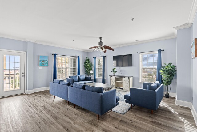 400 Hillside Dr S, North Myrtle Beach, SC 29582 - living area featuring wood finished floors, healthy amount of natural light, baseboards, and ornamental molding