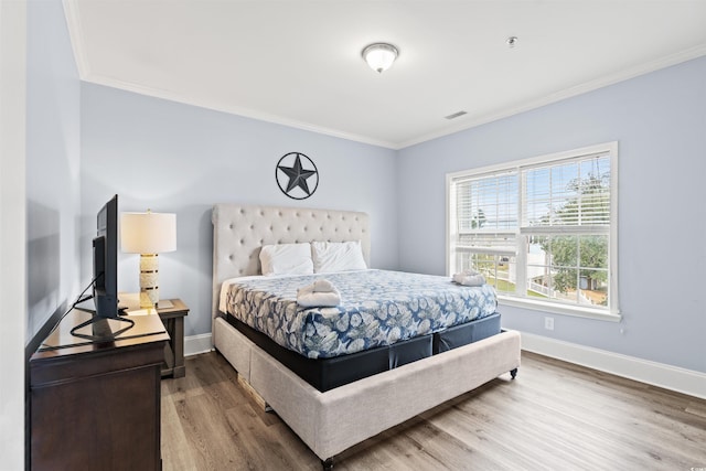 400 Hillside Dr S, North Myrtle Beach, SC 29582 - bedroom with ornamental molding, wood finished floors, and baseboards