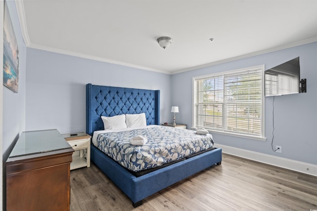 400 Hillside Dr S, North Myrtle Beach, SC 29582 - bedroom featuring ornamental molding, wood finished floors, and baseboards