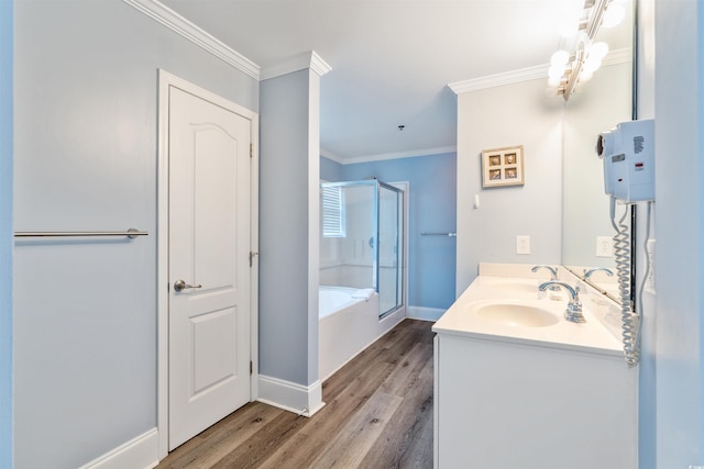 400 Hillside Dr S, North Myrtle Beach, SC 29582 - bathroom with a stall shower, wood finished floors, a garden tub, ornamental molding, and vanity