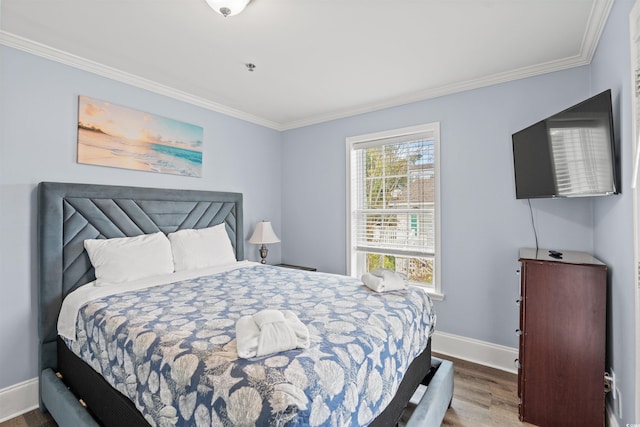 400 Hillside Dr S, North Myrtle Beach, SC 29582 - bedroom featuring ornamental molding, wood finished floors, and baseboards