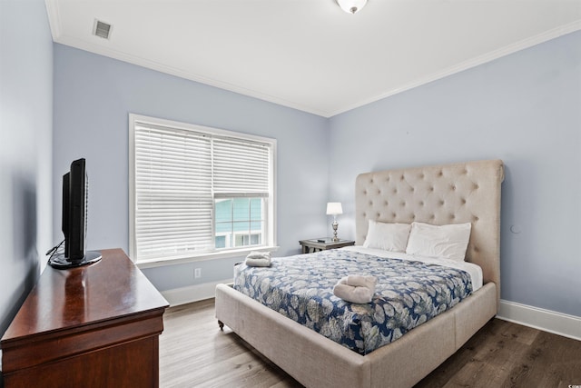400 Hillside Dr S, North Myrtle Beach, SC 29582 - bedroom with ornamental molding, wood finished floors, and baseboards