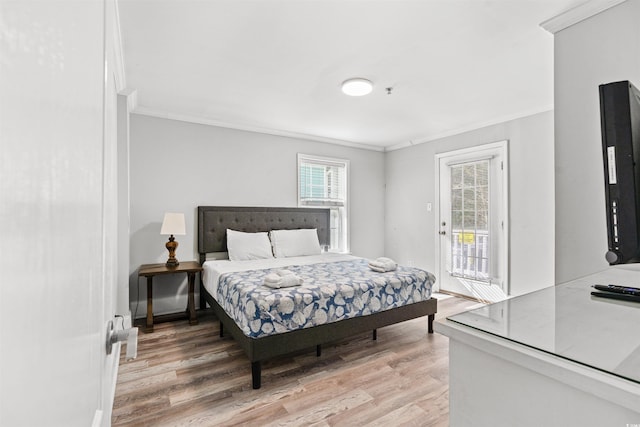 400 Hillside Dr S, North Myrtle Beach, SC 29582 - bedroom with crown molding, light wood finished floors, access to exterior, and baseboards