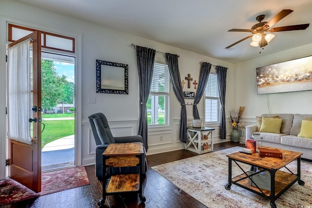 548 Fox Chase Dr, Conway, SC 29527 - living area featuring dark wood-style floors, ceiling fan, a wainscoted wall, and a decorative wall