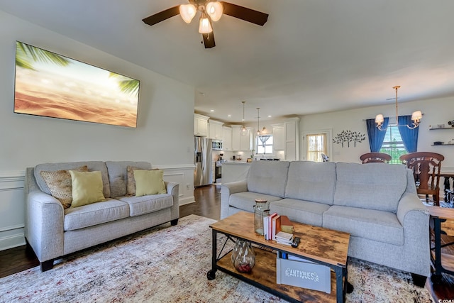 548 Fox Chase Dr, Conway, SC 29527 - living room with a ceiling fan, wood finished floors, a chandelier, recessed lighting, and a decorative wall