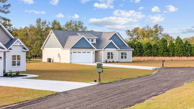1900 Blue Bird Rd, Loris, SC 29569 - view of front of home featuring concrete driveway, a front yard, a shingled roof, and a garage