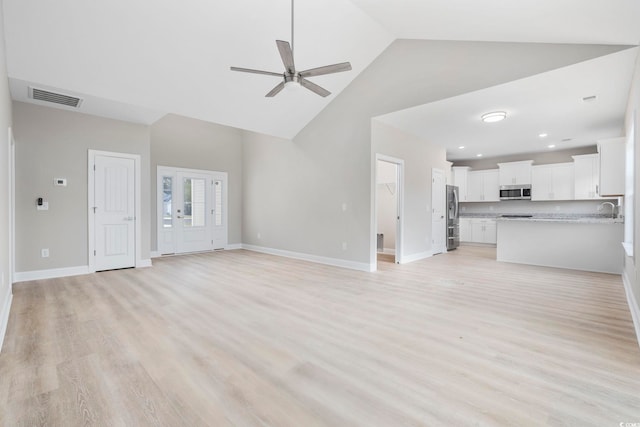 1900 Blue Bird Rd, Loris, SC 29569 - unfurnished living room featuring a ceiling fan, high vaulted ceiling, light wood-style floors, and recessed lighting
