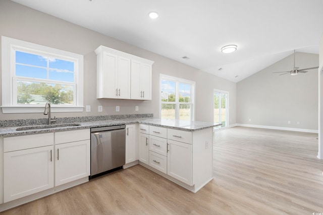 1900 Blue Bird Rd, Loris, SC 29569 - kitchen with a peninsula, light wood-type flooring, dishwasher, lofted ceiling, and plenty of natural light