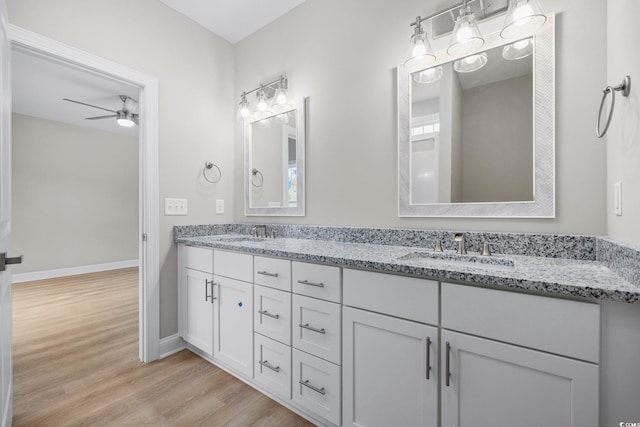 1900 Blue Bird Rd, Loris, SC 29569 - bathroom featuring double vanity, wood finished floors, and a ceiling fan