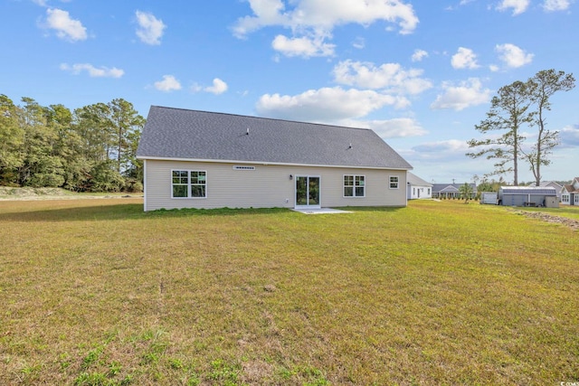 1900 Blue Bird Rd, Loris, SC 29569 - back of house with a lawn, a patio, and a shingled roof