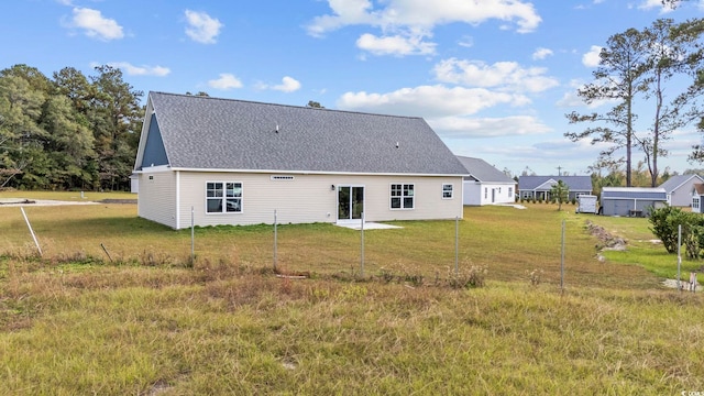 1900 Blue Bird Rd, Loris, SC 29569 - back of house with a shingled roof and a lawn