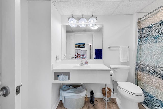 2501 S Ocean Blvd Unit 111, Myrtle Beach, SC 29577 - bathroom with toilet, wood finished floors, vanity, and a shower with shower curtain