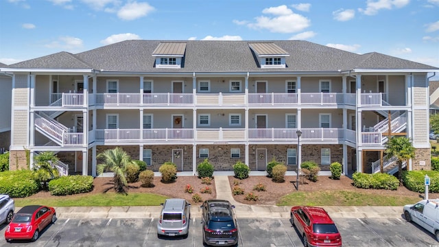 600 Heathrow Dr Unit 1084, Myrtle Beach, SC 29579 - view of building exterior featuring uncovered parking
