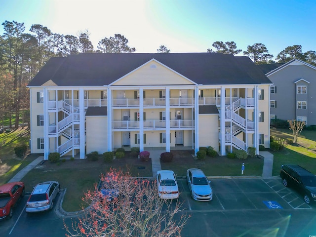 5822 Longwood Dr Unit 104, Murrells Inlet, SC 29576 - view of property featuring uncovered parking