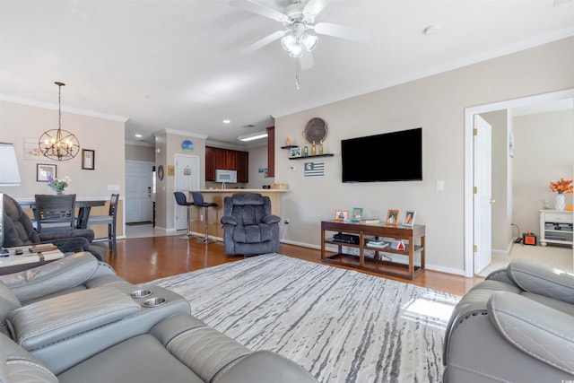 5822 Longwood Dr Unit 104, Murrells Inlet, SC 29576 - living area with a chandelier, wood finished floors, ceiling fan, baseboards, and ornamental molding