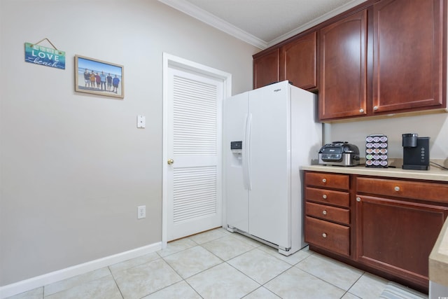 5822 Longwood Dr Unit 104, Murrells Inlet, SC 29576 - kitchen featuring white fridge with ice dispenser, ornamental molding, light countertops, light tile patterned floors, and baseboards