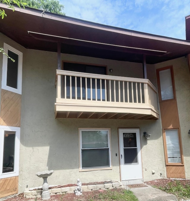 600 65th Ave N Unit 8, Myrtle Beach, SC 29572 - rear view of property featuring a balcony and stucco siding